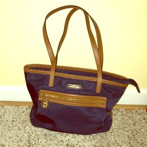Navy and brown Michael Kors shoulder bag.